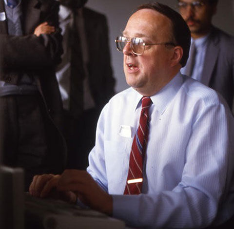 John Swanson working at a computer